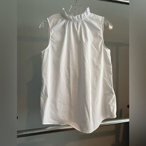 Cute Ruffle neck sleeveless top. White.